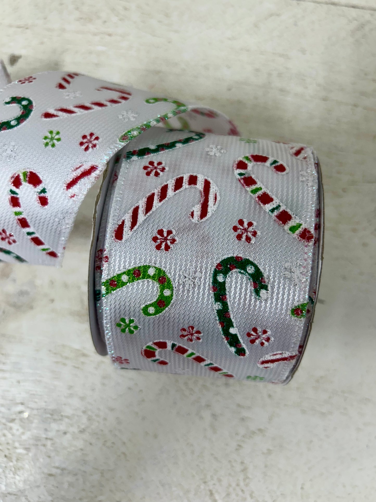 2.5 Inch By 10 Yard Multicolored Candy Canes With Multicolored Snowflakes On A White Textured Background Ribbon