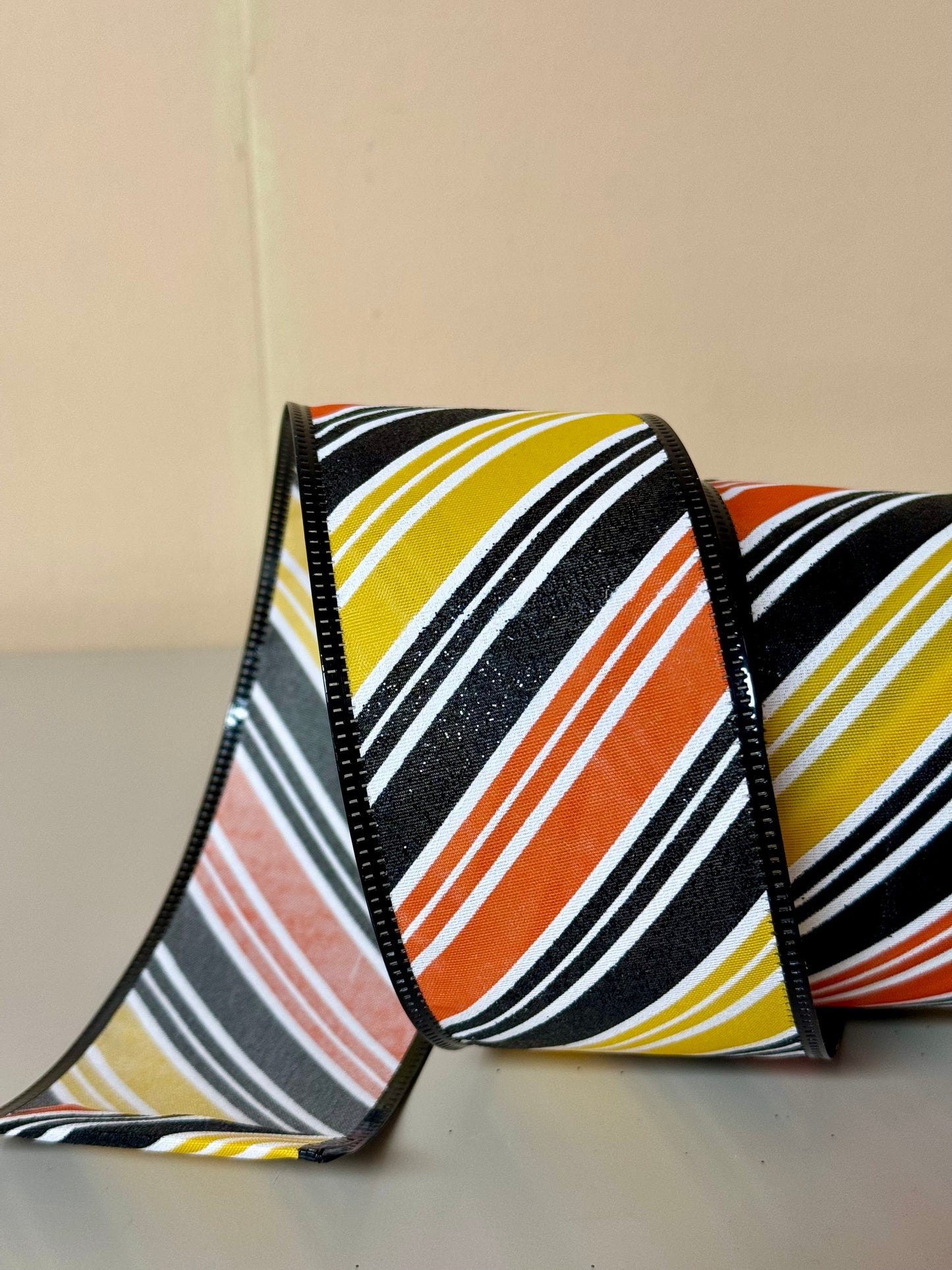 2.5 Inch By 10 Yard Orange Black And Yellow Diagonal Striped Ribbon