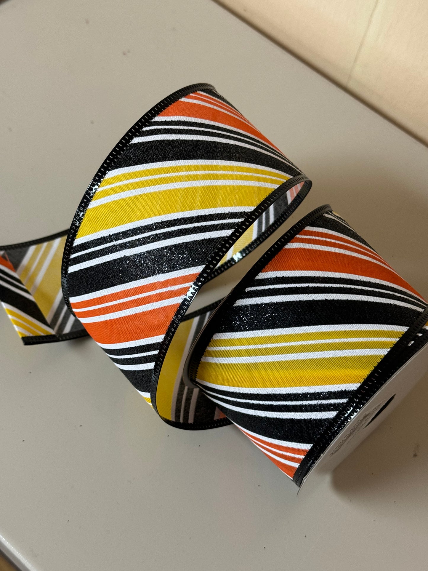 2.5 Inch By 10 Yard Orange Black And Yellow Diagonal Striped Ribbon