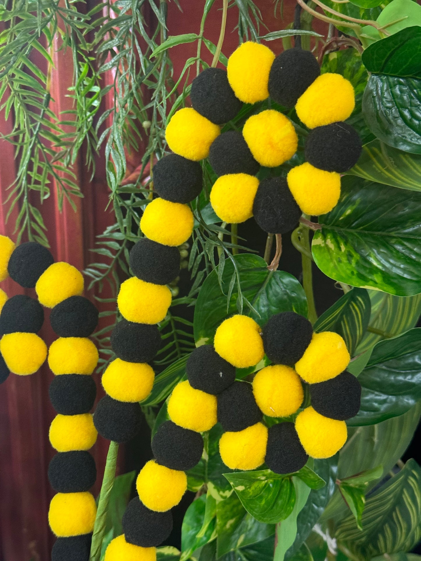 27 Inch Black And Yellow Pom Pom Coil Spray