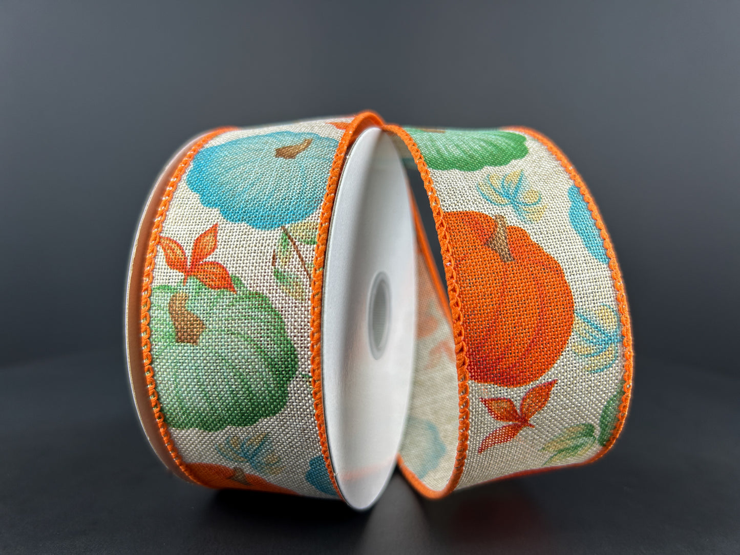 1.5 Inch By 10 Yard Natural Background With Orange Blue And Teal Pumpkins Ribbon