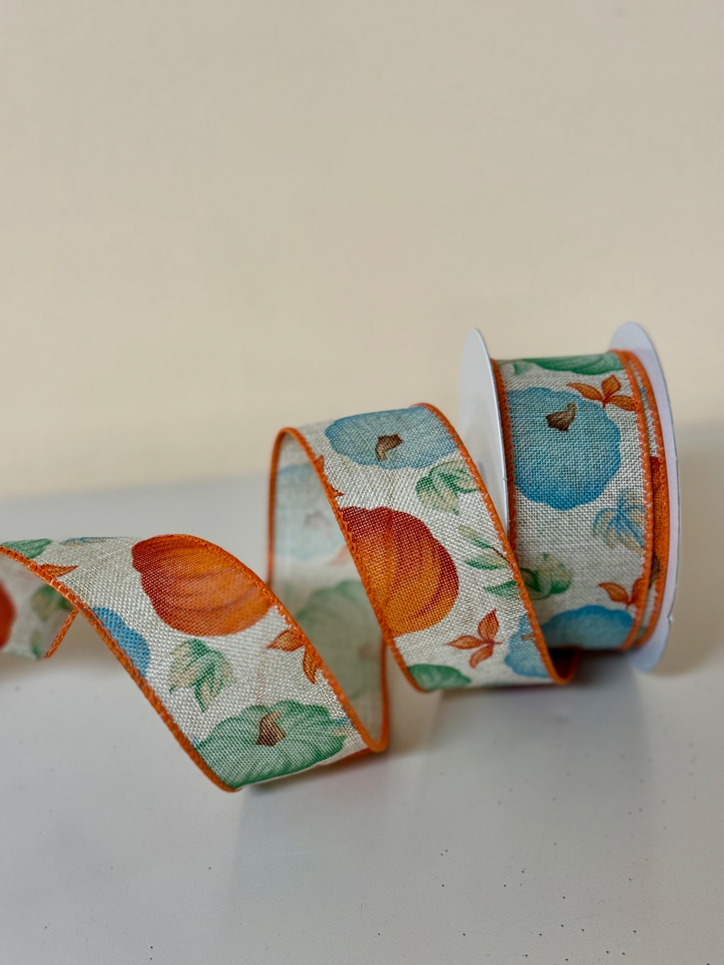 1.5 Inch By 10 Yard Natural Background With Orange Blue And Teal Pumpkins Ribbon