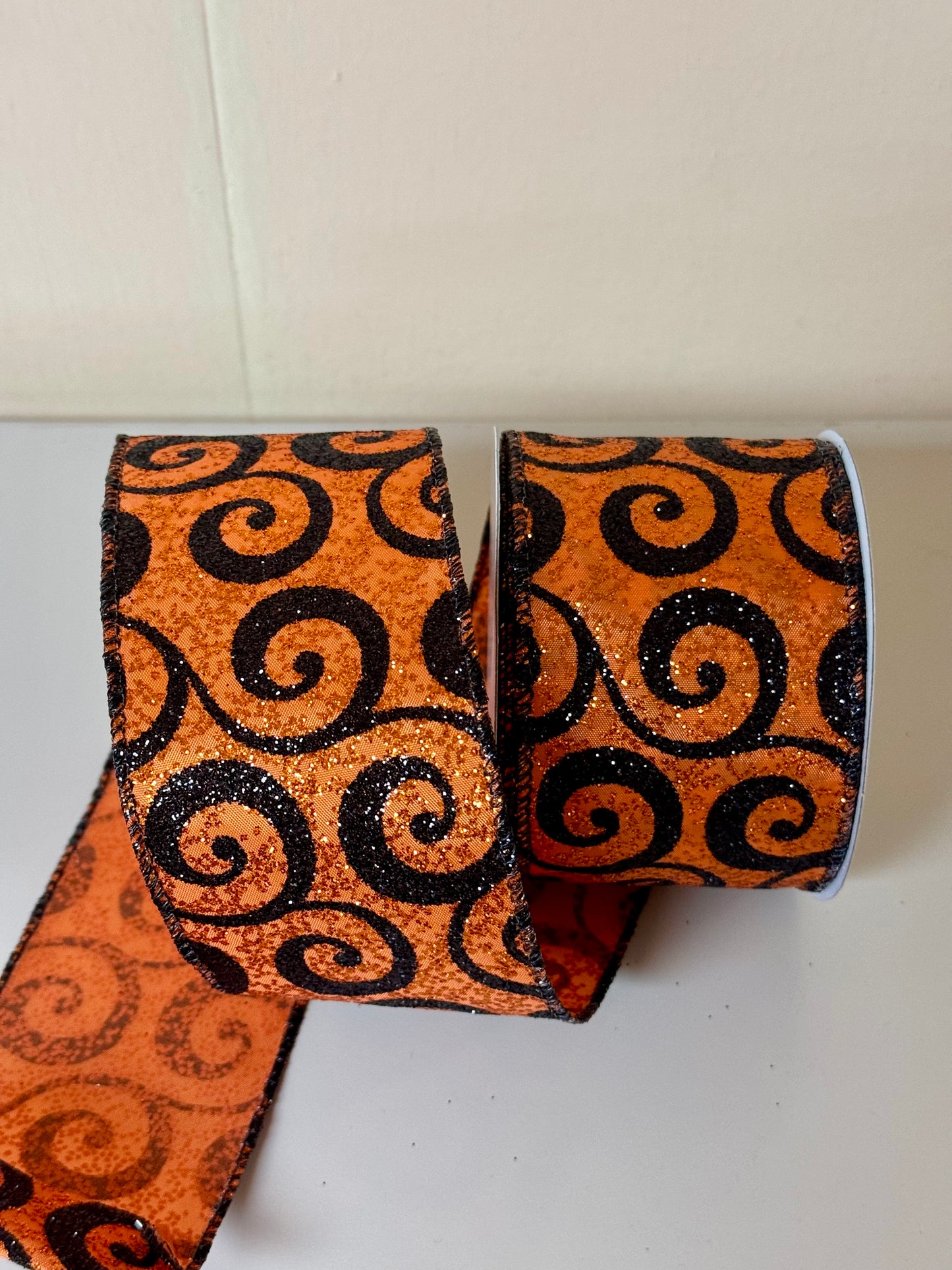 2.5 Inch By 10 Yard Orange With Black Glitter Swirls Ribbon