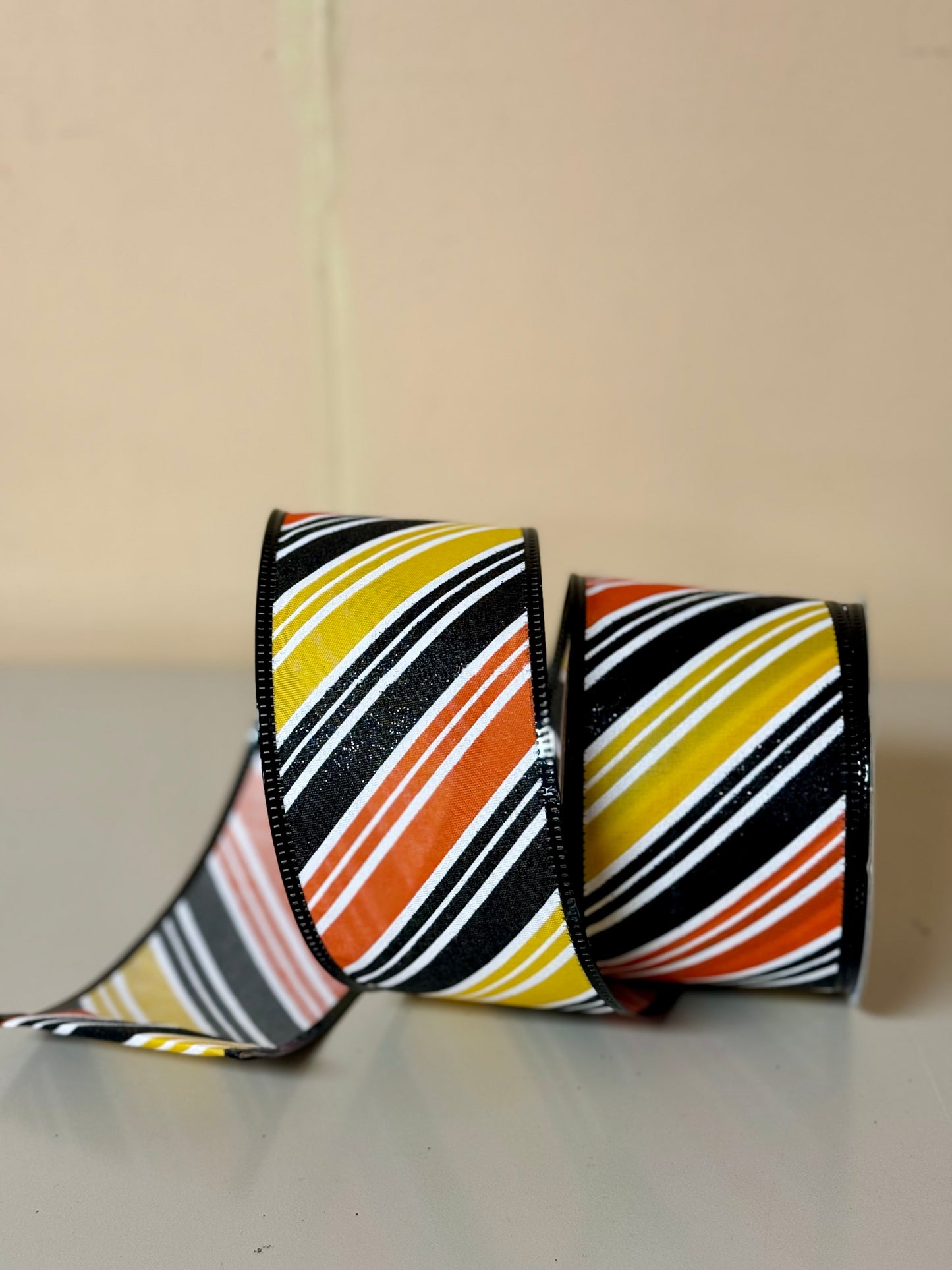 2.5 Inch By 10 Yard Orange Black And Yellow Diagonal Striped Ribbon