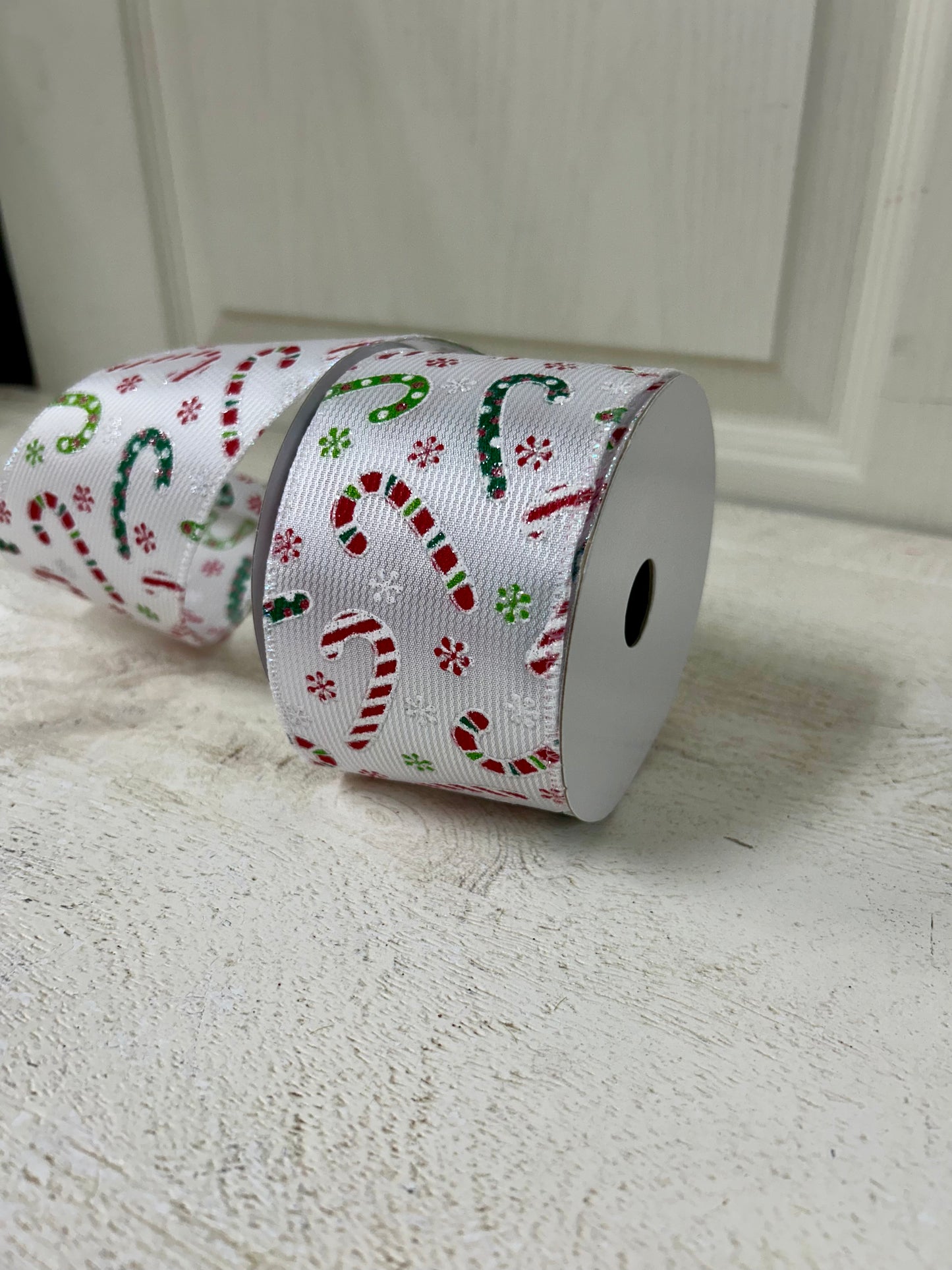 2.5 Inch By 10 Yard Multicolored Candy Canes With Multicolored Snowflakes On A White Textured Background Ribbon