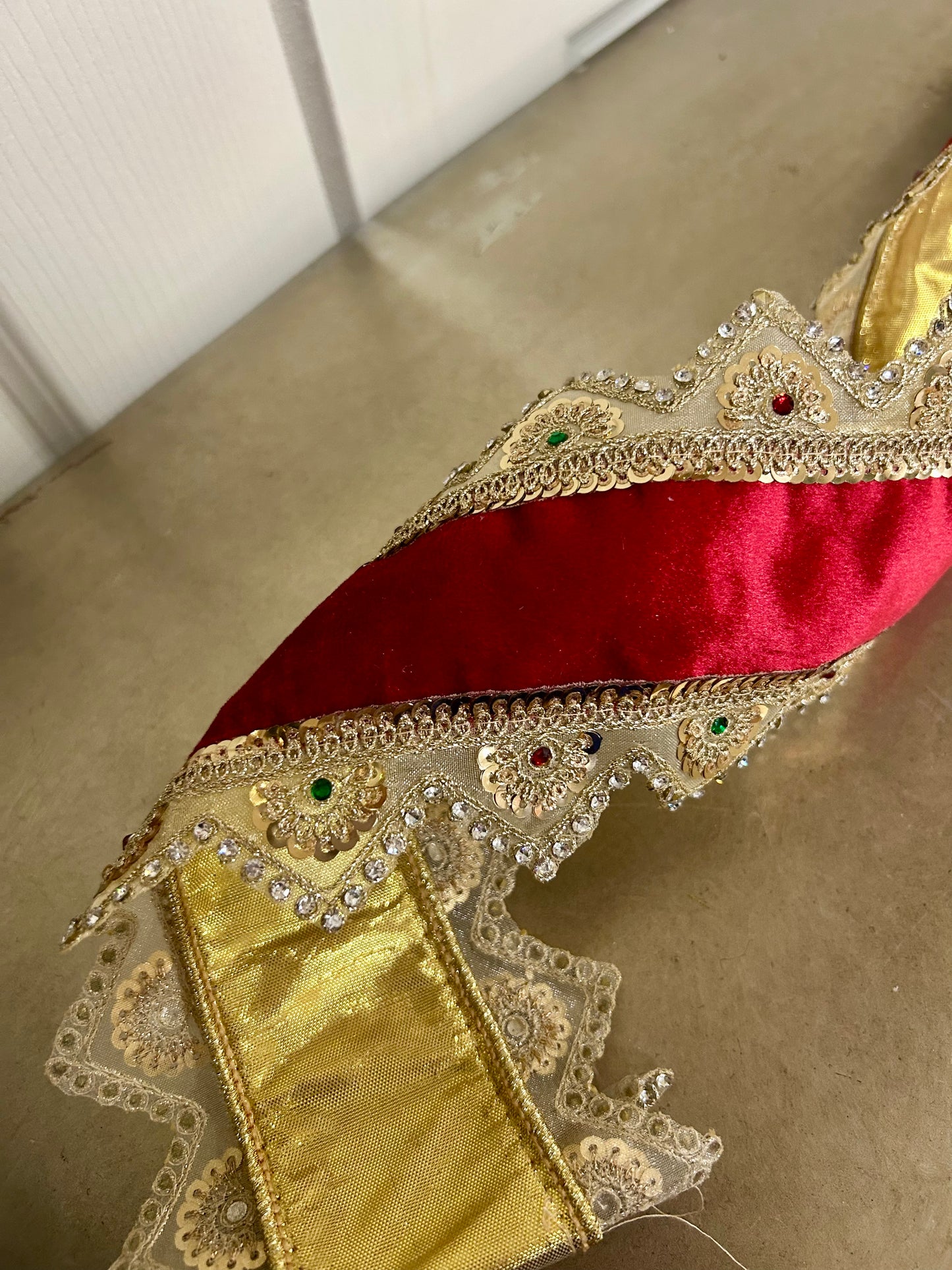 4 Inch By 5 Yard Gold Trim With Jewels On The Edge Of Red Ribbon