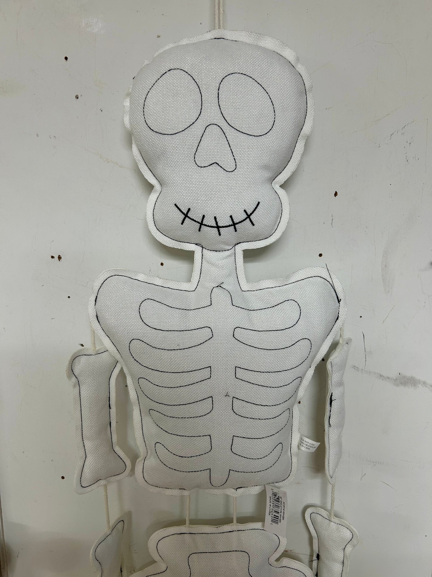 50 Inch Black And White Plush Hanging Skeleton