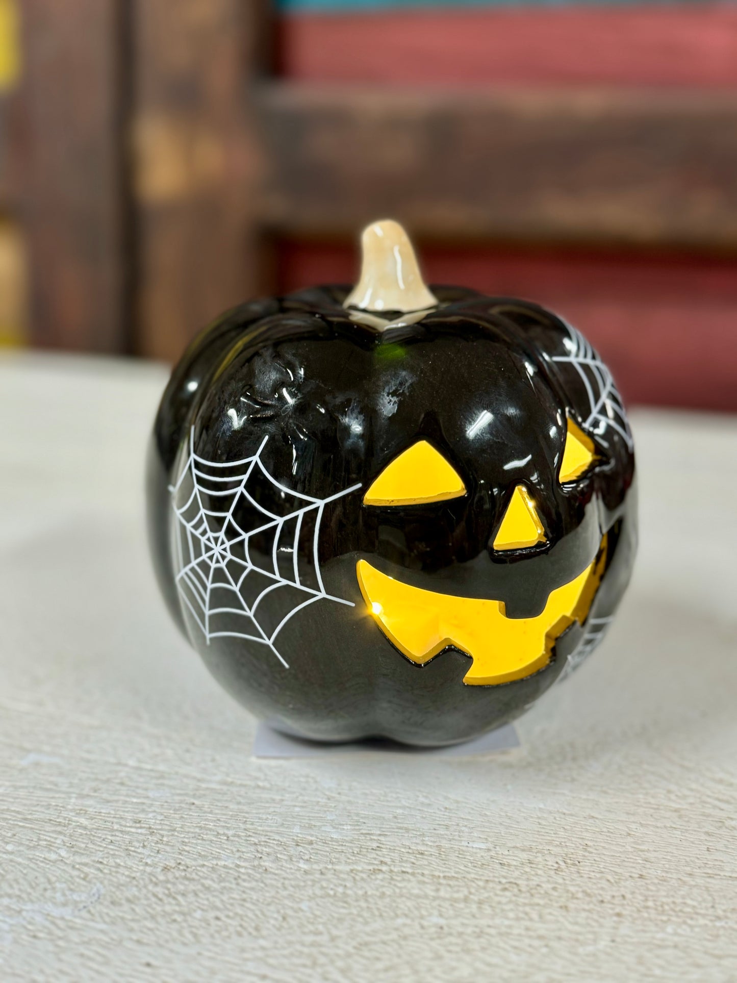 Black Light Up Ceramic Pumpkin With Spider Webs