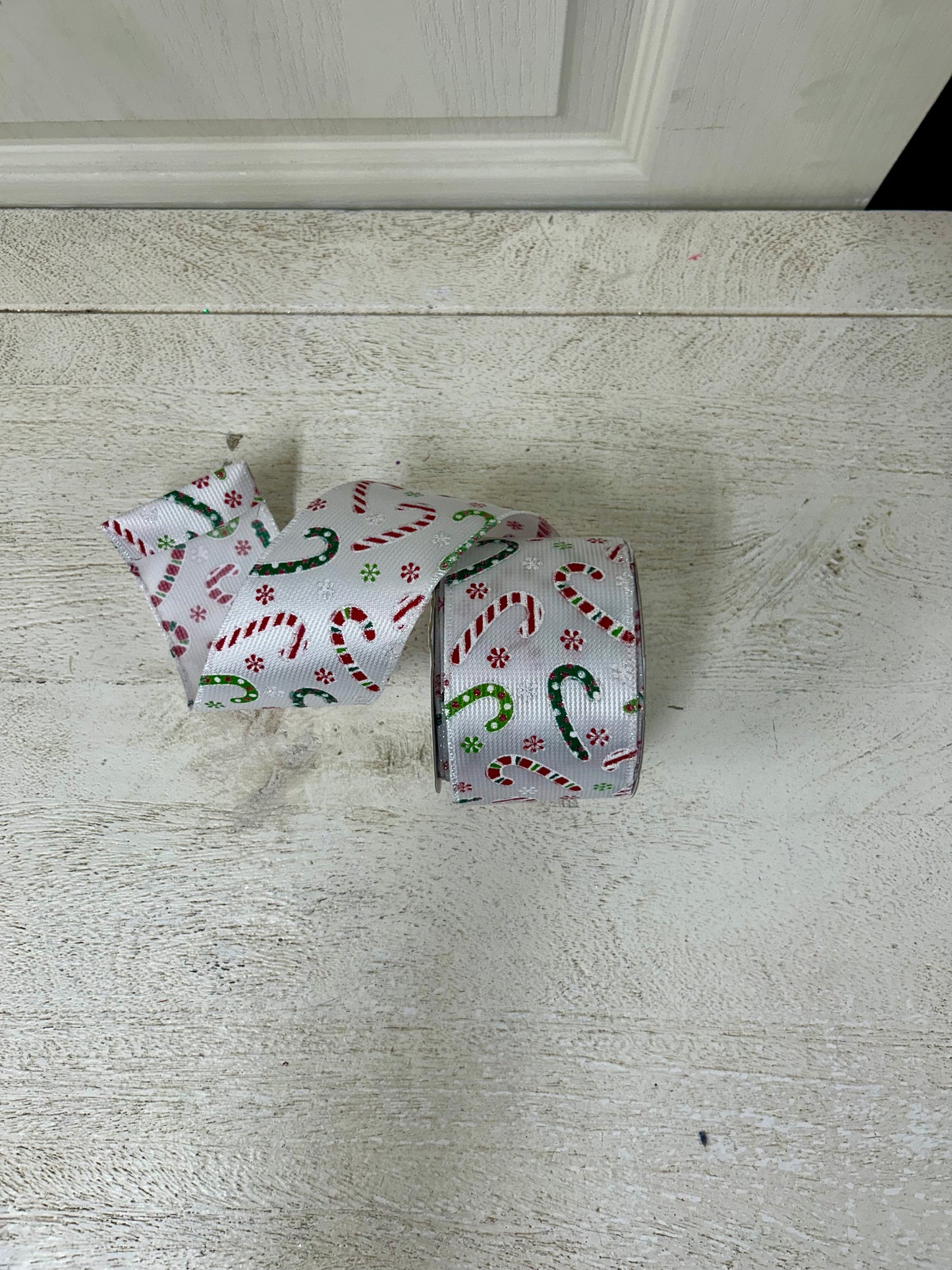 2.5 Inch By 10 Yard Multicolored Candy Canes With Multicolored Snowflakes On A White Textured Background Ribbon