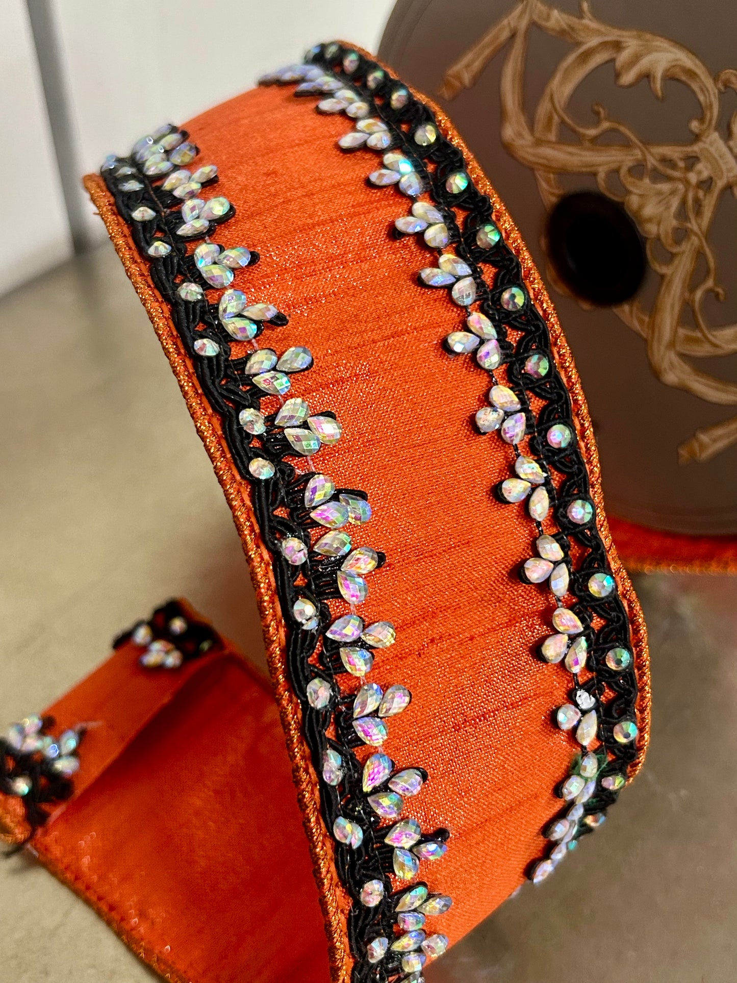 2.5 Inch By 5 Yards Orange And Black Metallic Dupioni With Iris Jewel Trim Ribbon