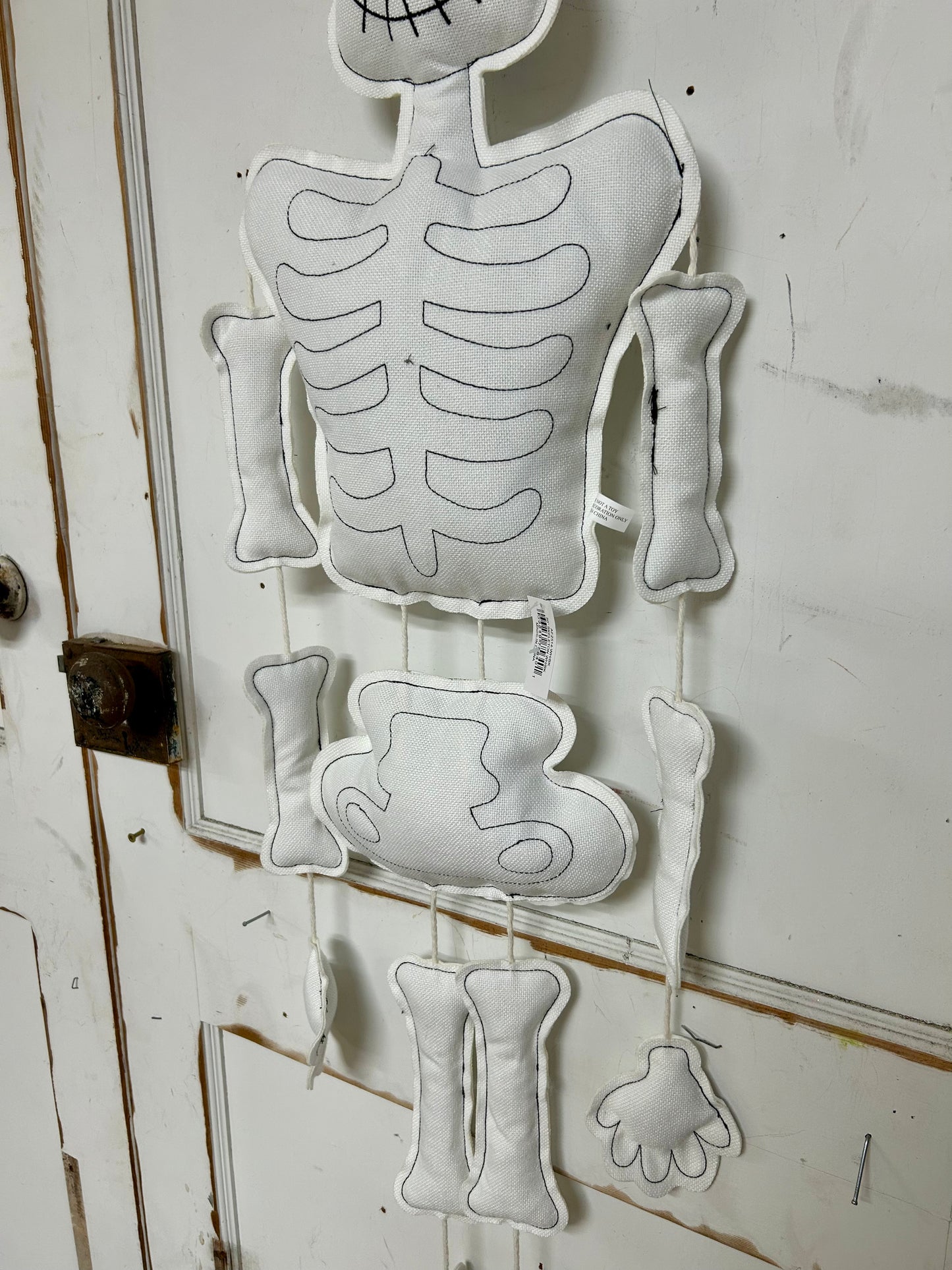 50 Inch Black And White Plush Hanging Skeleton