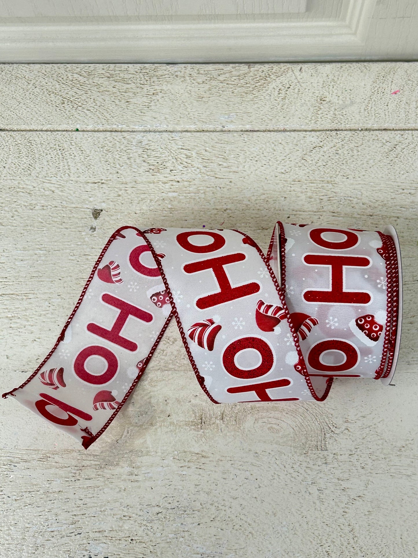 2.5 Inch By 10 Yard Red Glitter Ho Ho Ho With Santa Hats And Snowflakes With White Background And Red Edging Ribbon