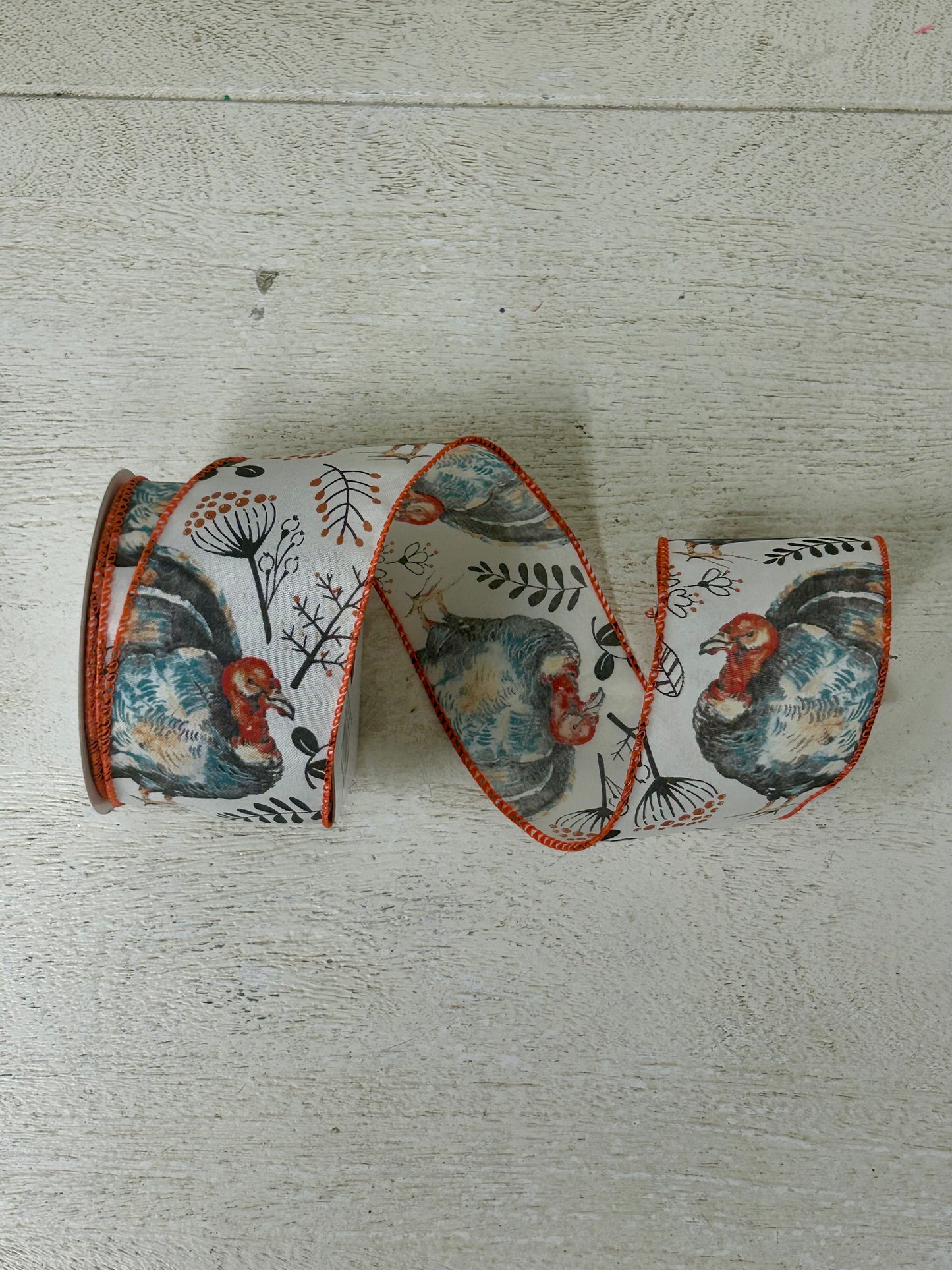 2.5 Inch By 10 Yard Blue And Orange Turkey With Orange Berry Sprays With A White Background And Orange Edging Ribbon