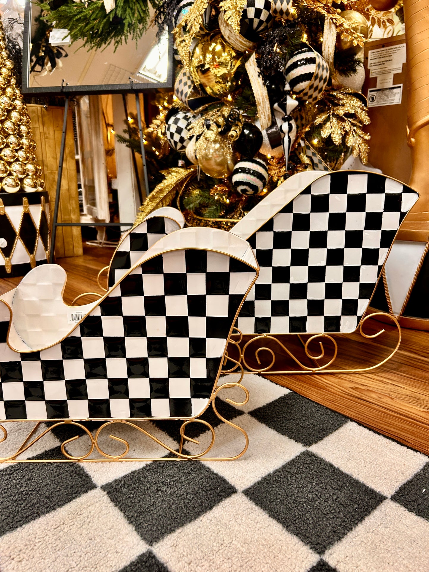 Set Of Two Black And White Checker Metal Sleighs