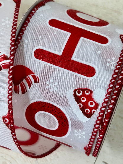 2.5 Inch By 10 Yard Red Glitter Ho Ho Ho With Santa Hats And Snowflakes With White Background And Red Edging Ribbon