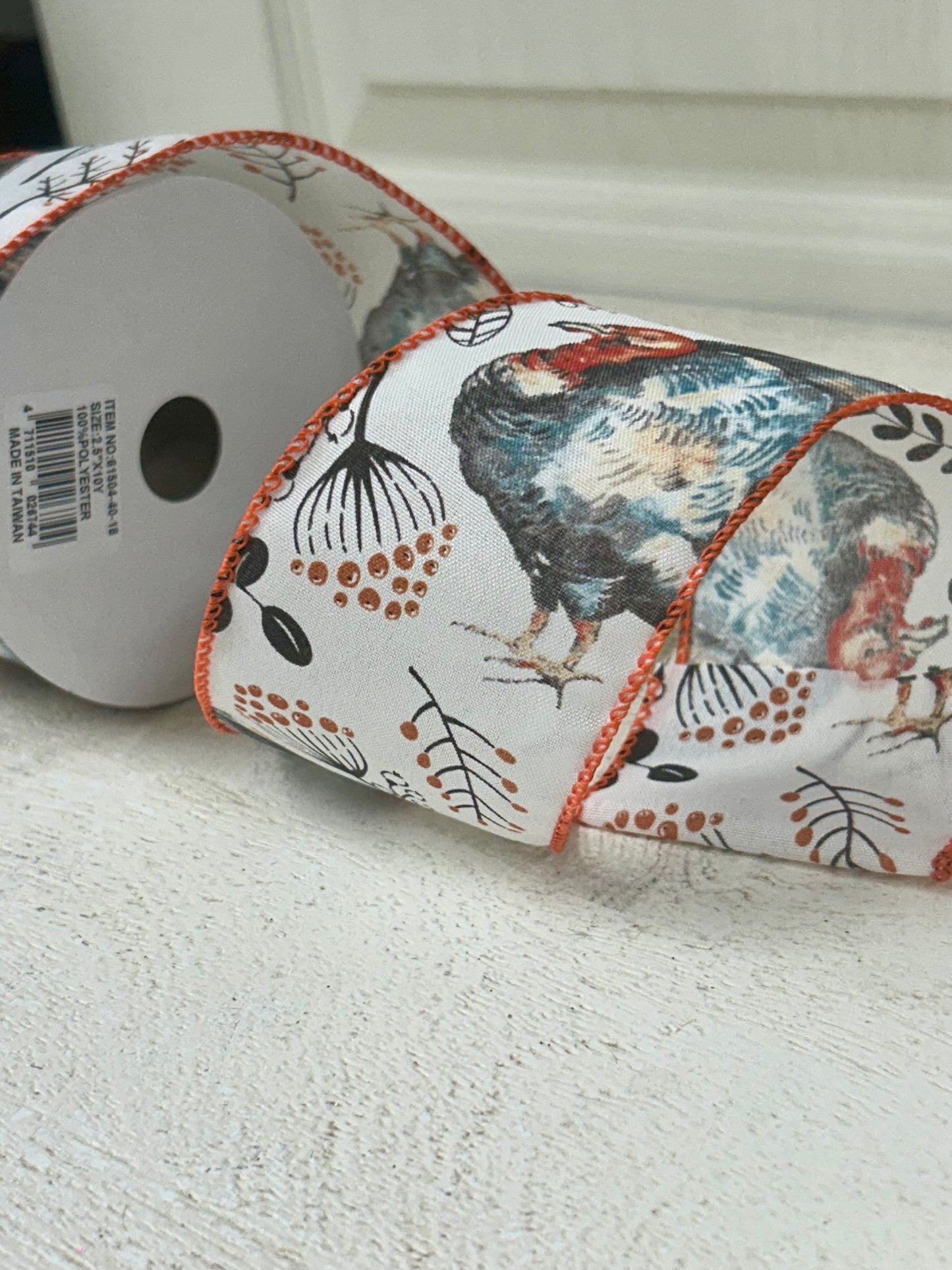 2.5 Inch By 10 Yard Blue And Orange Turkey With Orange Berry Sprays With A White Background And Orange Edging Ribbon