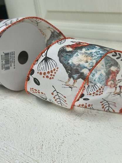 2.5 Inch By 10 Yard Blue And Orange Turkey With Orange Berry Sprays With A White Background And Orange Edging Ribbon