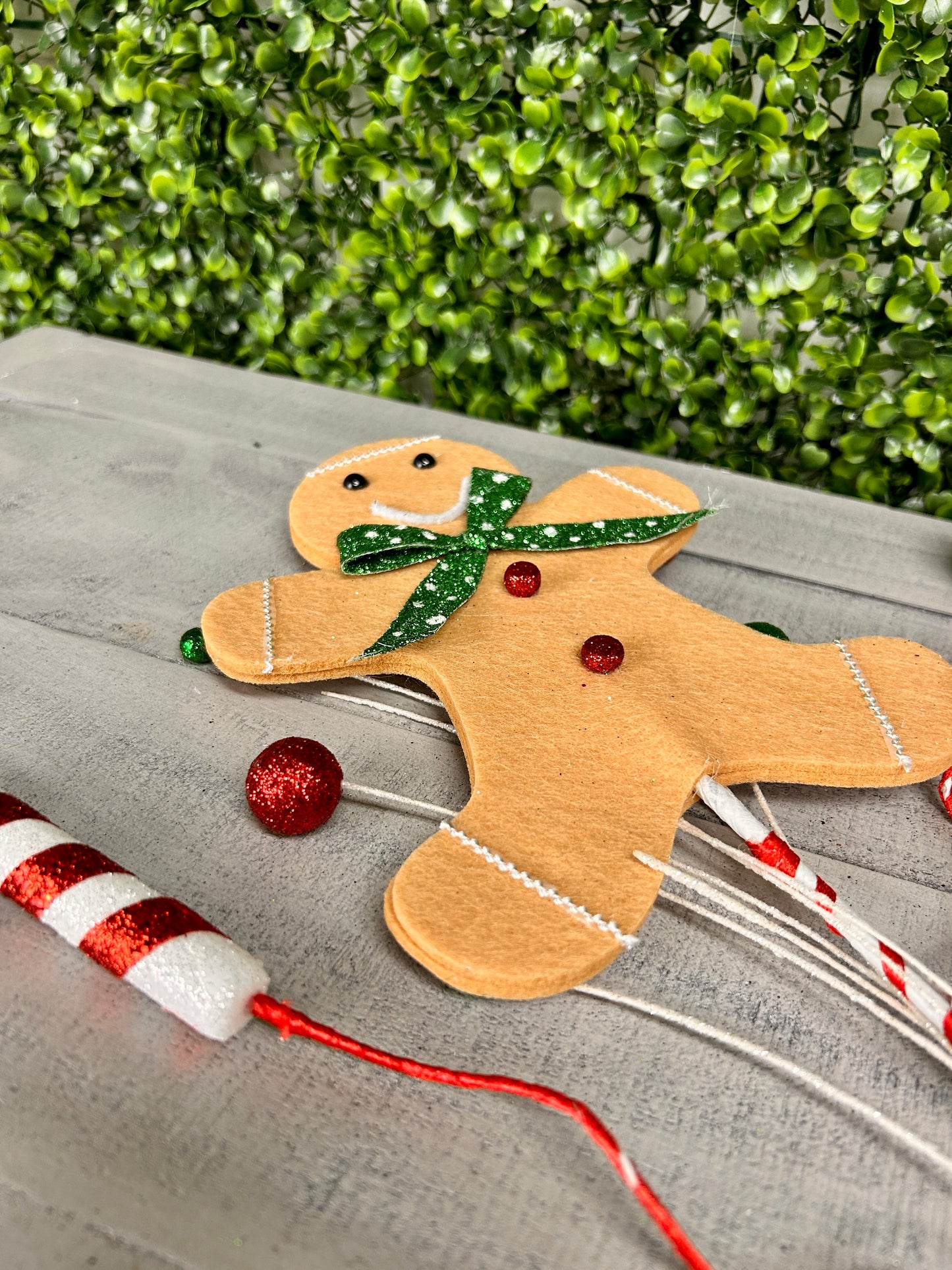 25 Inch Brown Emerald And Red Gingerbread Man With Candy Spray