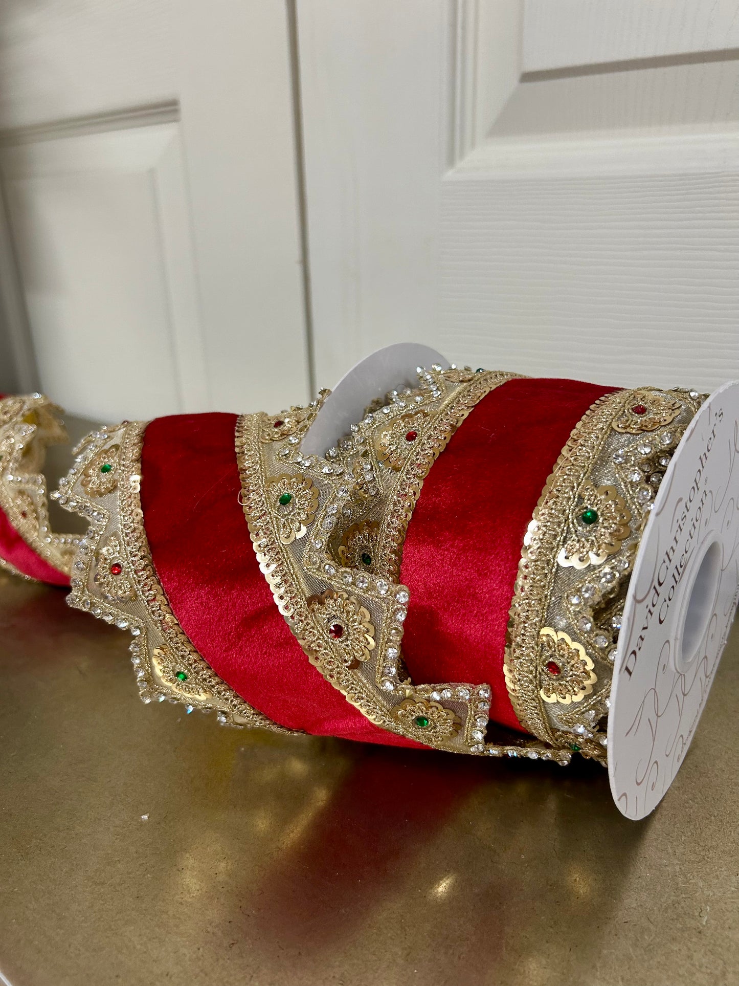 4 Inch By 5 Yard Gold Trim With Jewels On The Edge Of Red Ribbon