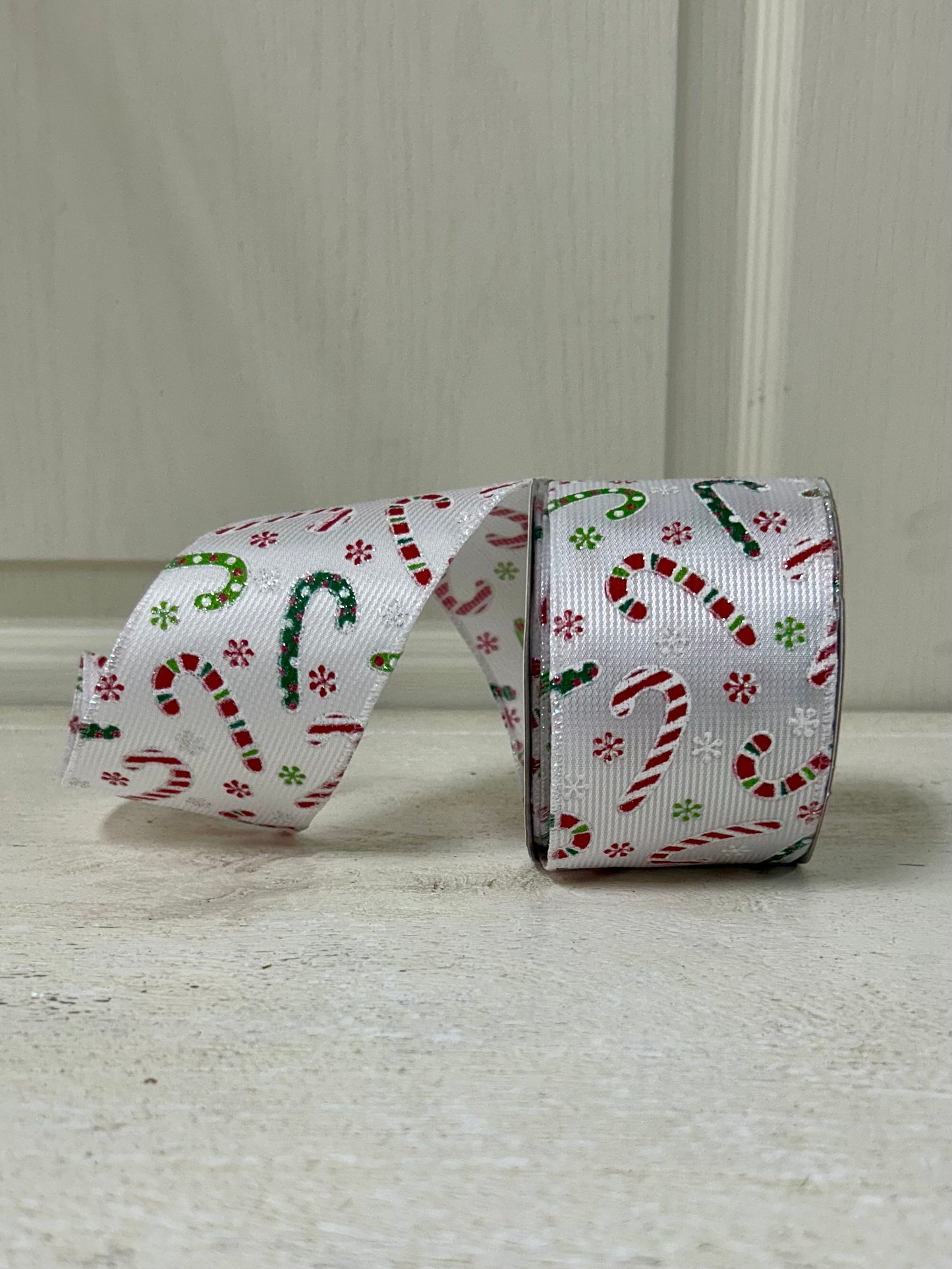2.5 Inch By 10 Yard Multicolored Candy Canes With Multicolored Snowflakes On A White Textured Background Ribbon